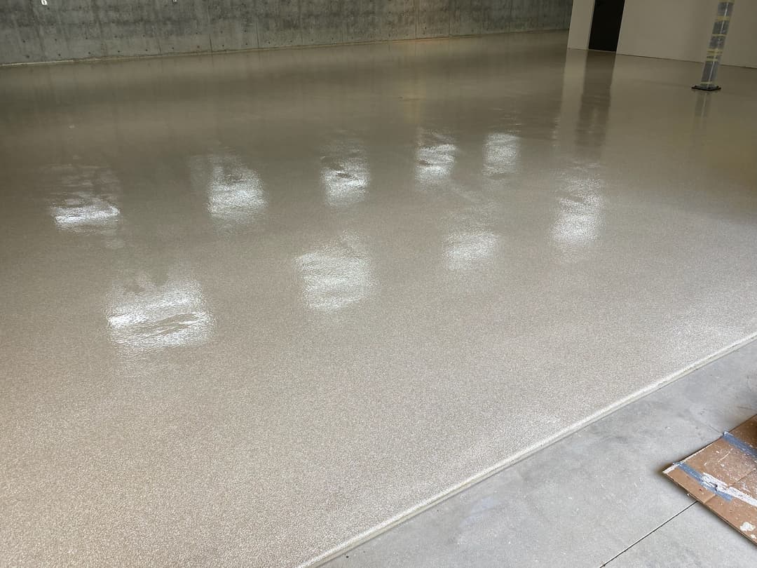 Glossy polished concrete floor in a spacious modern interior.